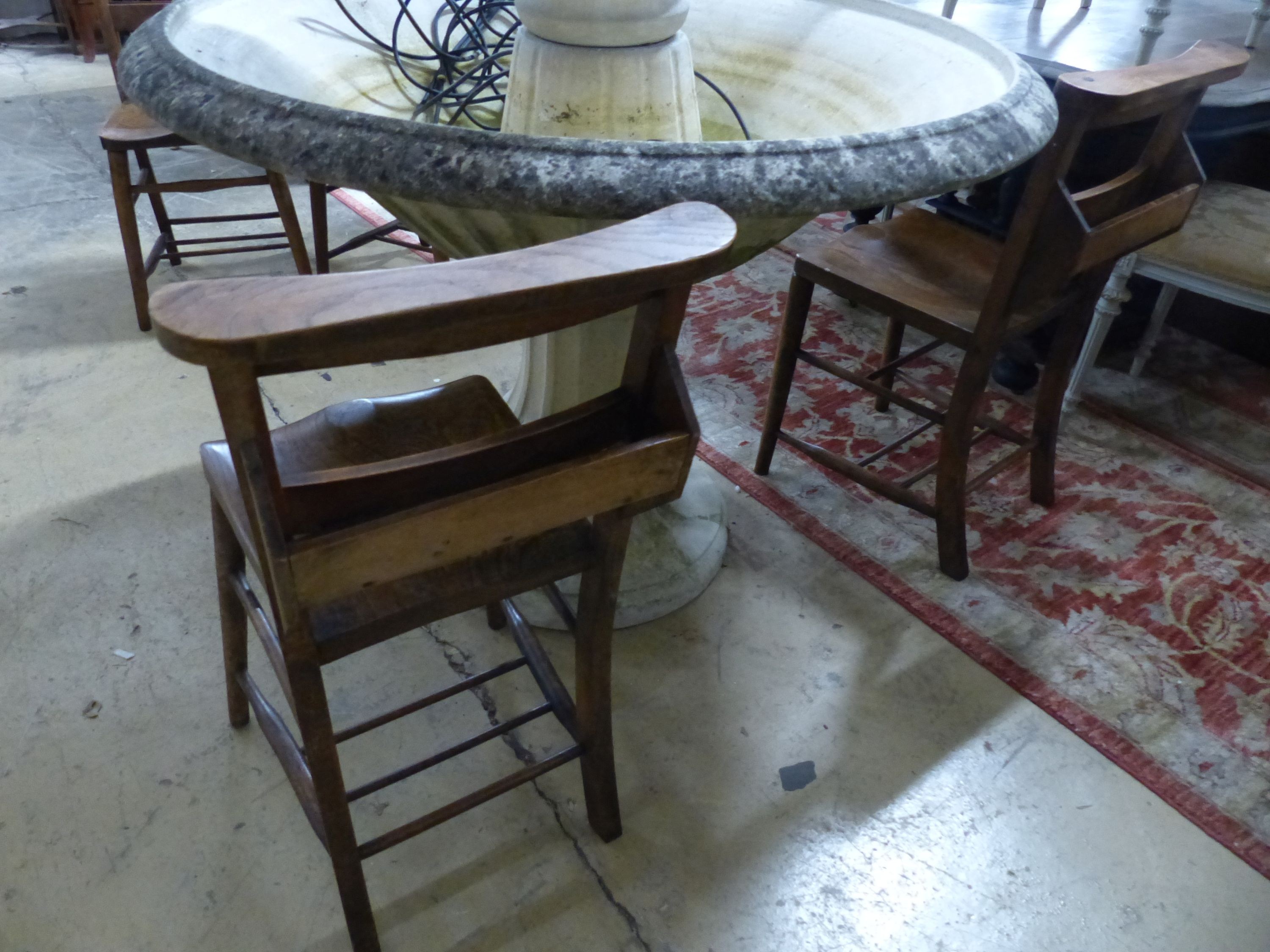 A set of four Victorian elm chapel chairs